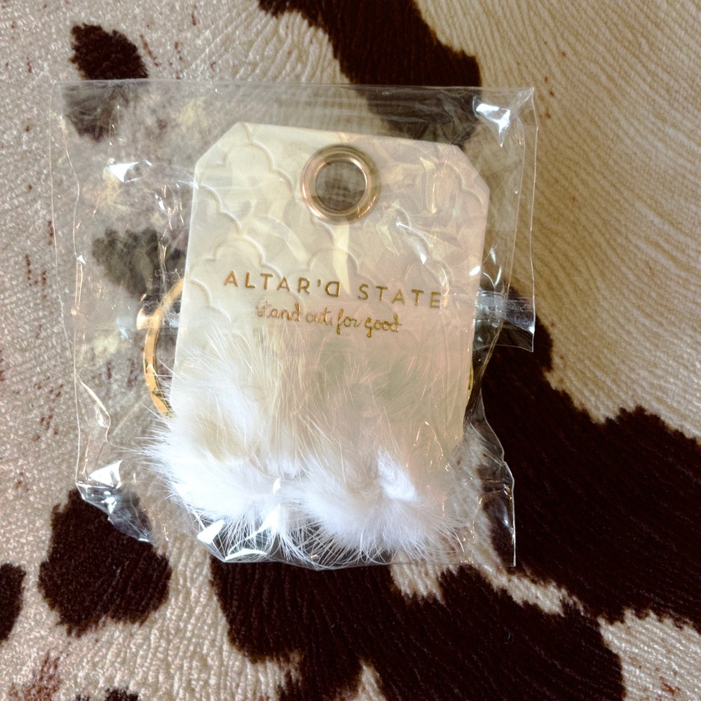 Puff ball hoop earrings from Altar’d State